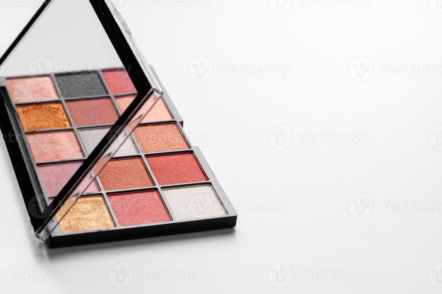 Make up colorful eyeshadow palettes on white photo