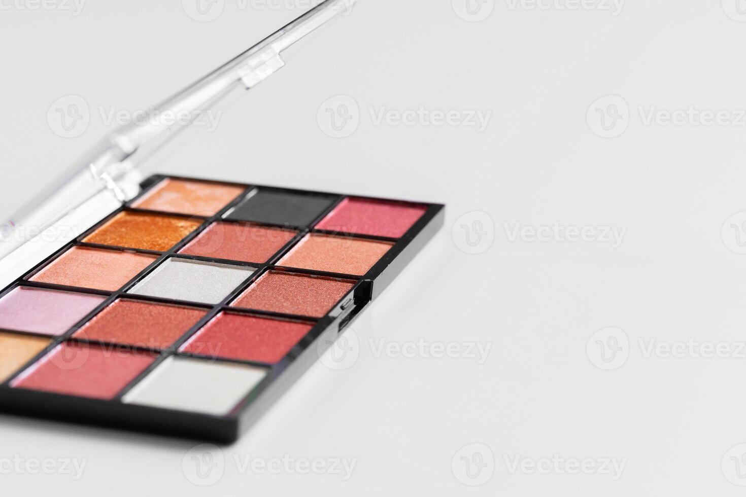 Make up colorful eyeshadow palettes on white photo