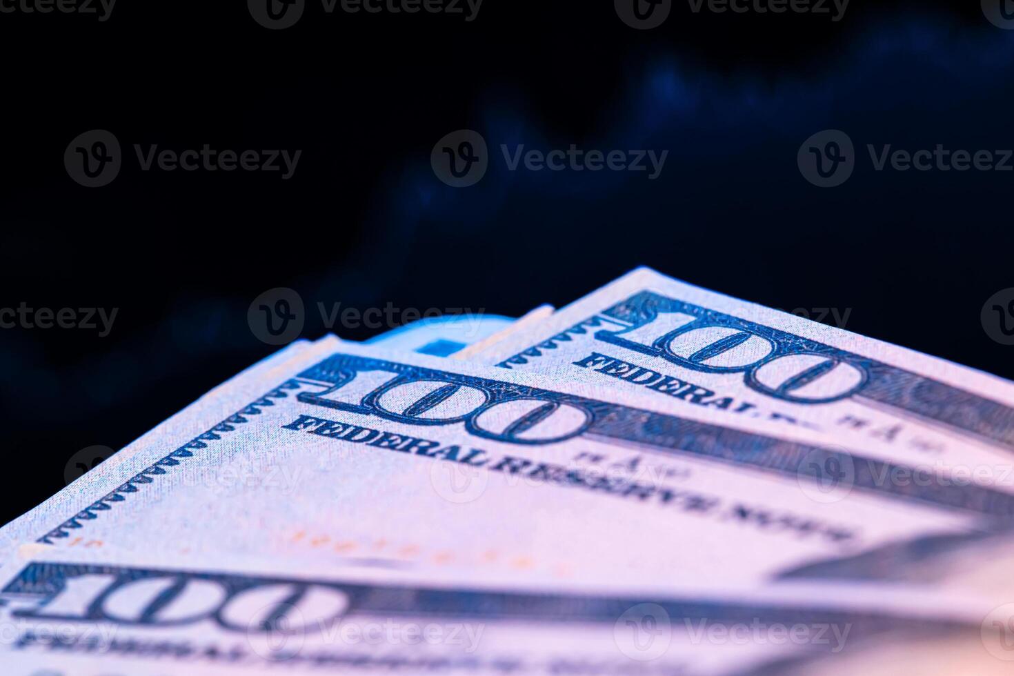 Dollars in front of a monitor with a price chart. Forex and trading. photo