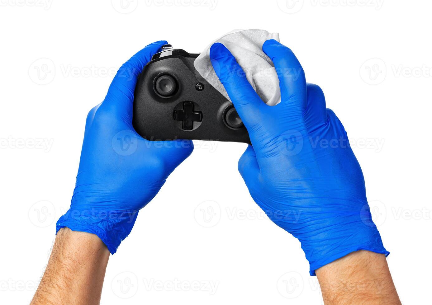 game console controller in gamer gloved hands. Games during isolation at home photo
