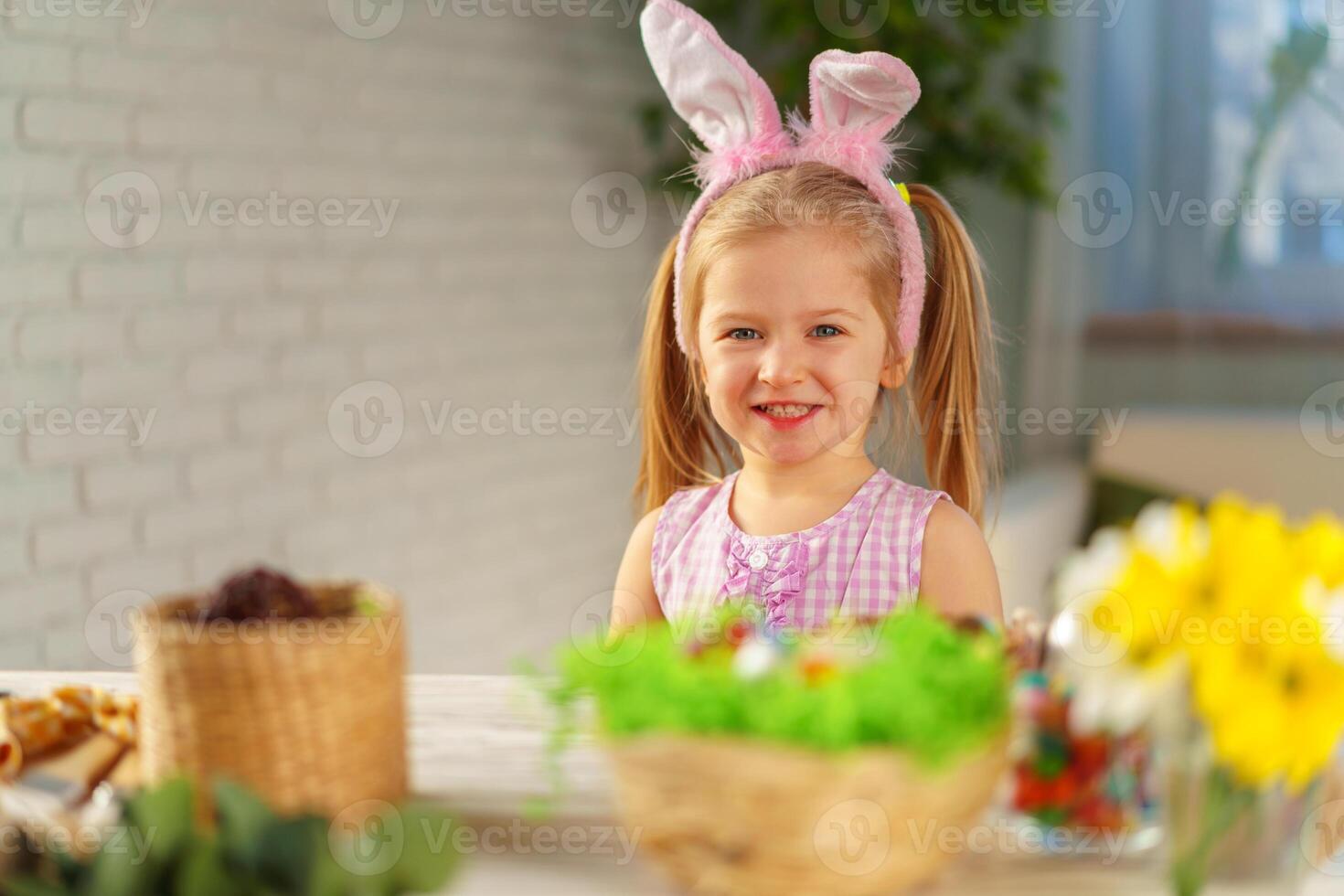 Portrait of a cute toddler girl with bunny ears photo
