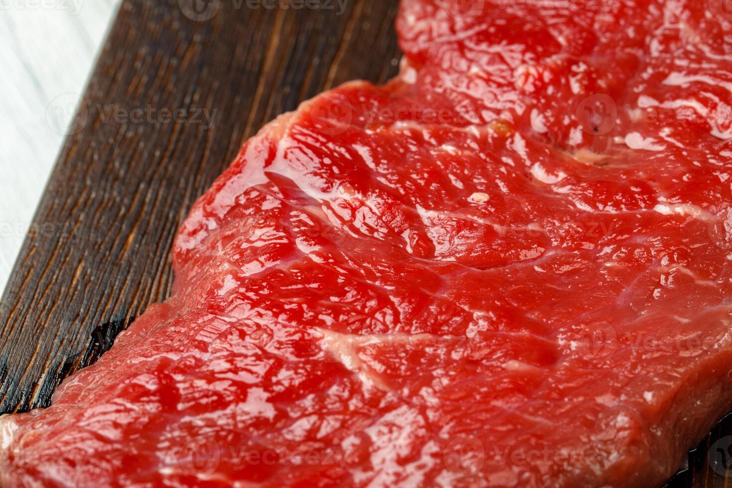 Close up of fresh uncooked rib eye steak photo