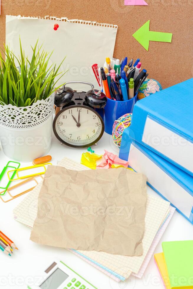 Work place of a creative person with a variety of colorful stationery objects photo