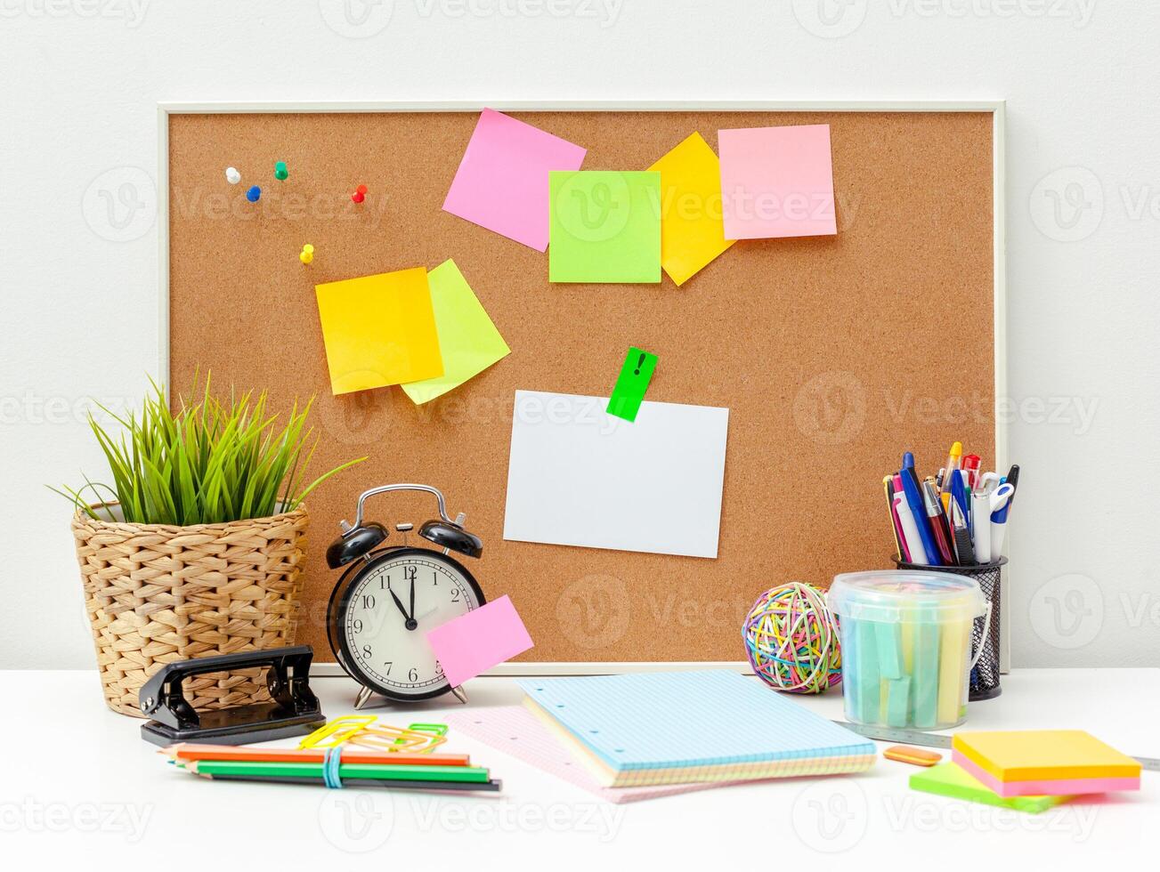 Work place of a creative person with a variety of colorful stationery objects photo