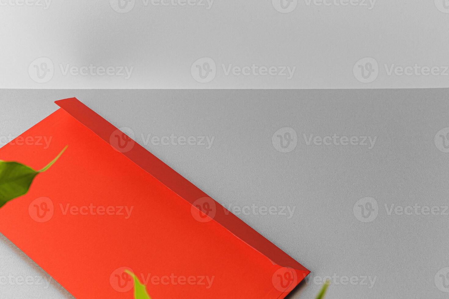 Flat lay craft paper card mockup with leaves photo