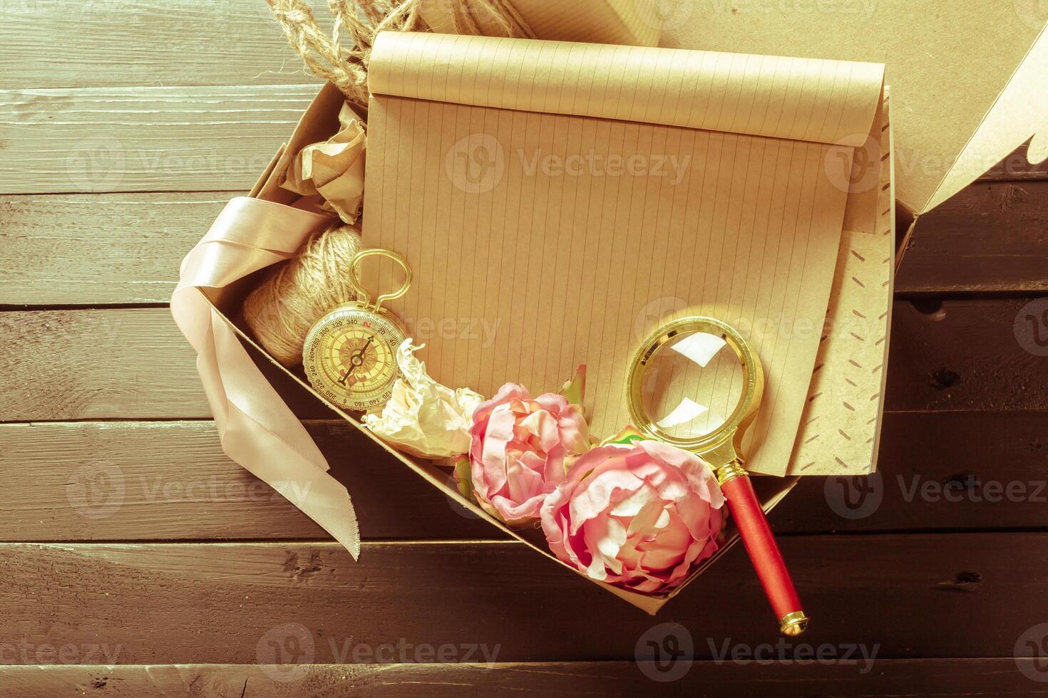 flowers and a notebook on wooden background photo
