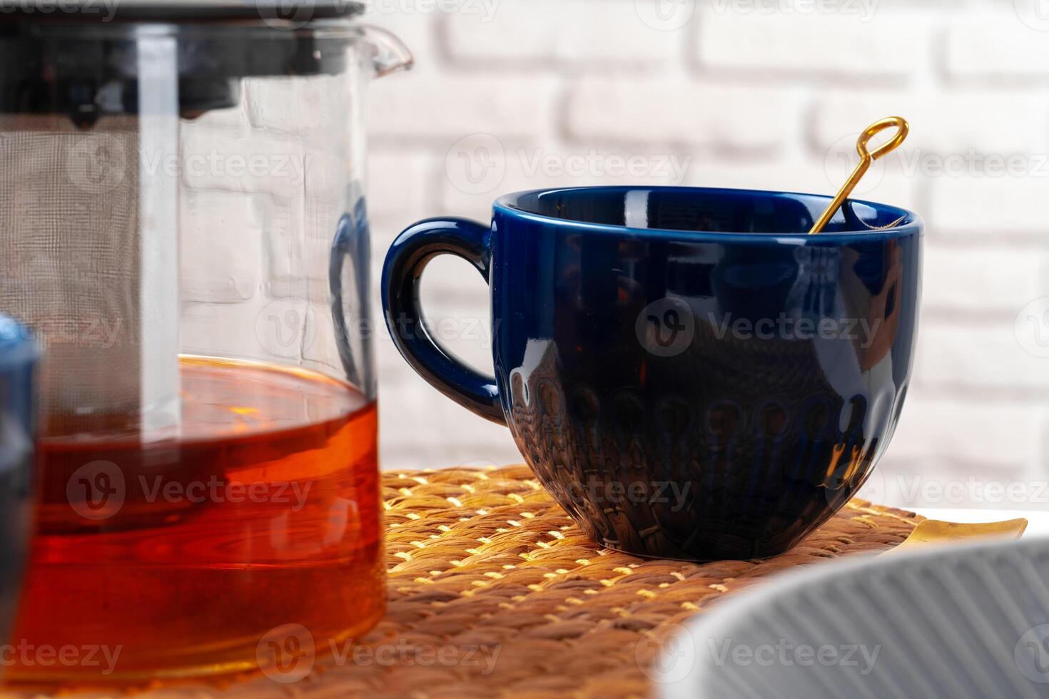 Classic blue empty ceramic tea cup on kitchen table photo