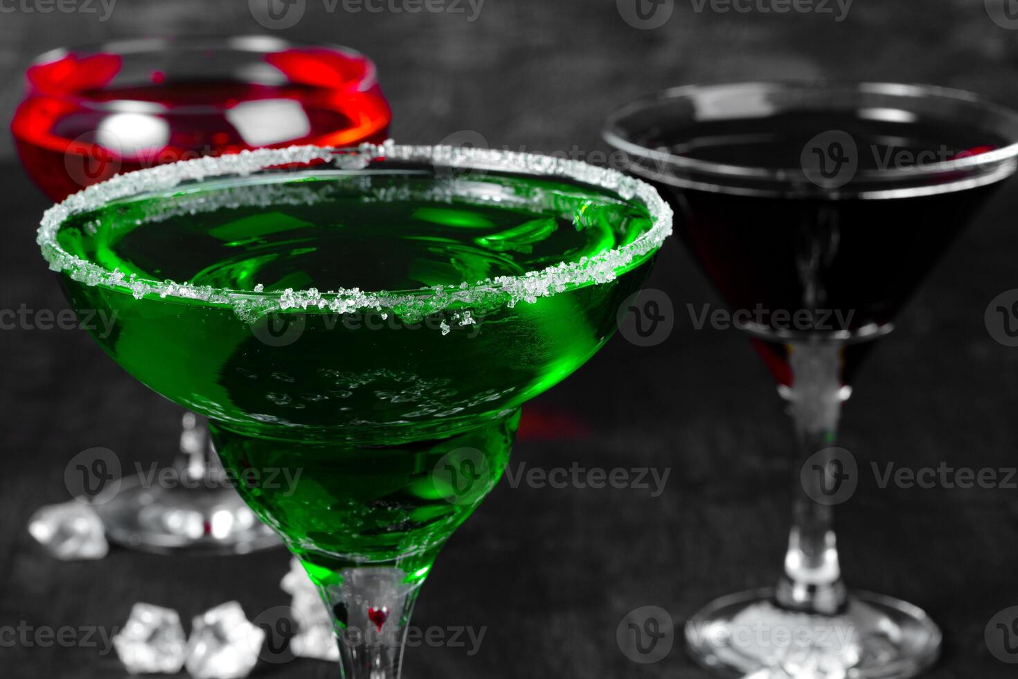 Beautiful alciohol cocktail on dark stone table photo