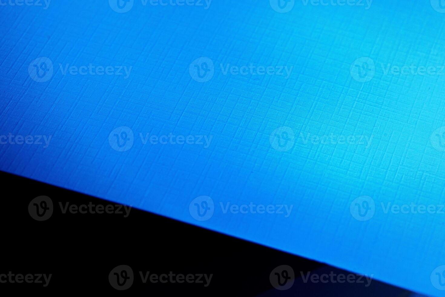 Blank carton paper sheets background in dark blue light photo