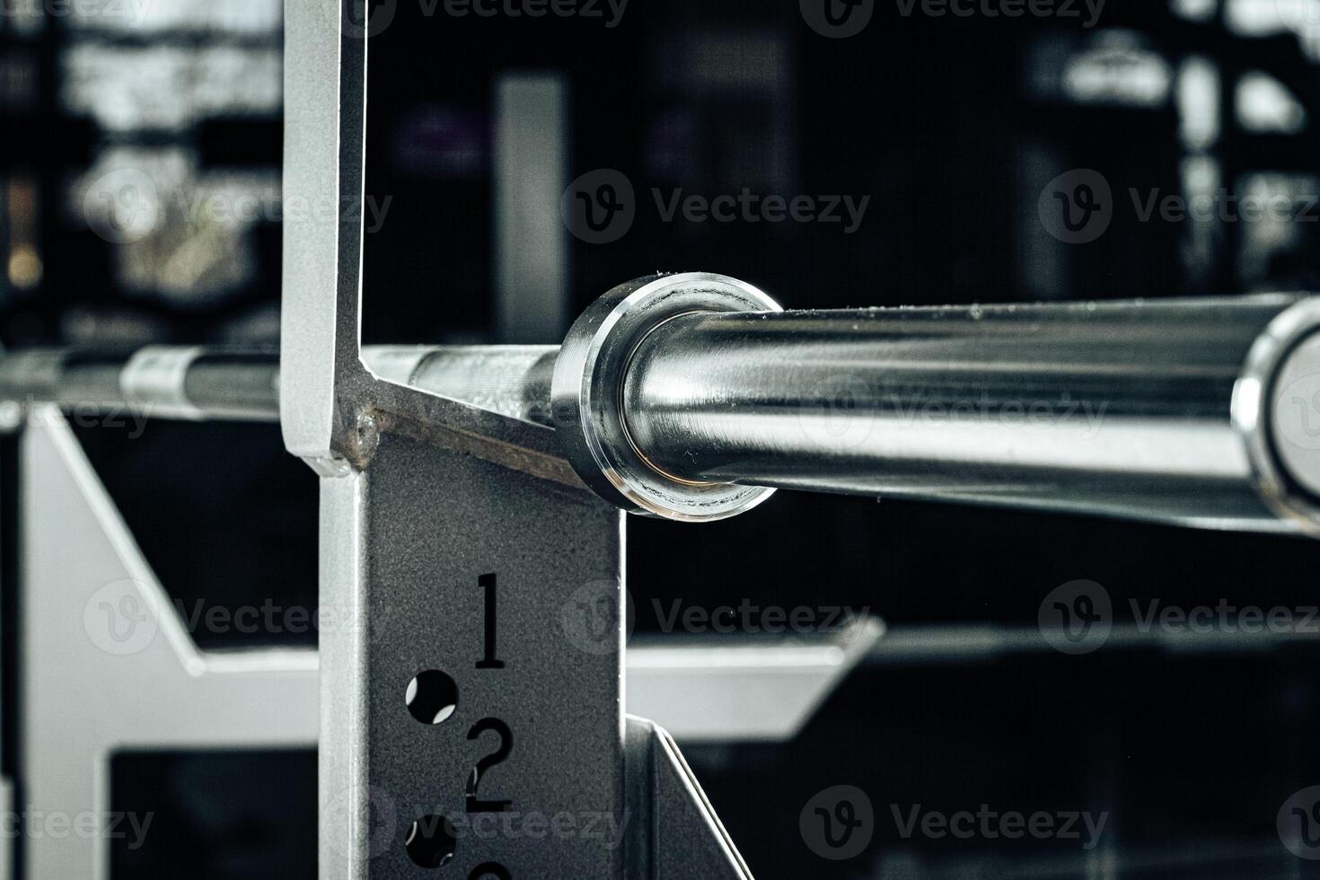 Metal gym weight bar for powerlifting close up photo