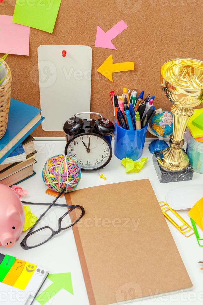 Work place of a creative person with a variety of colorful stationery objects photo
