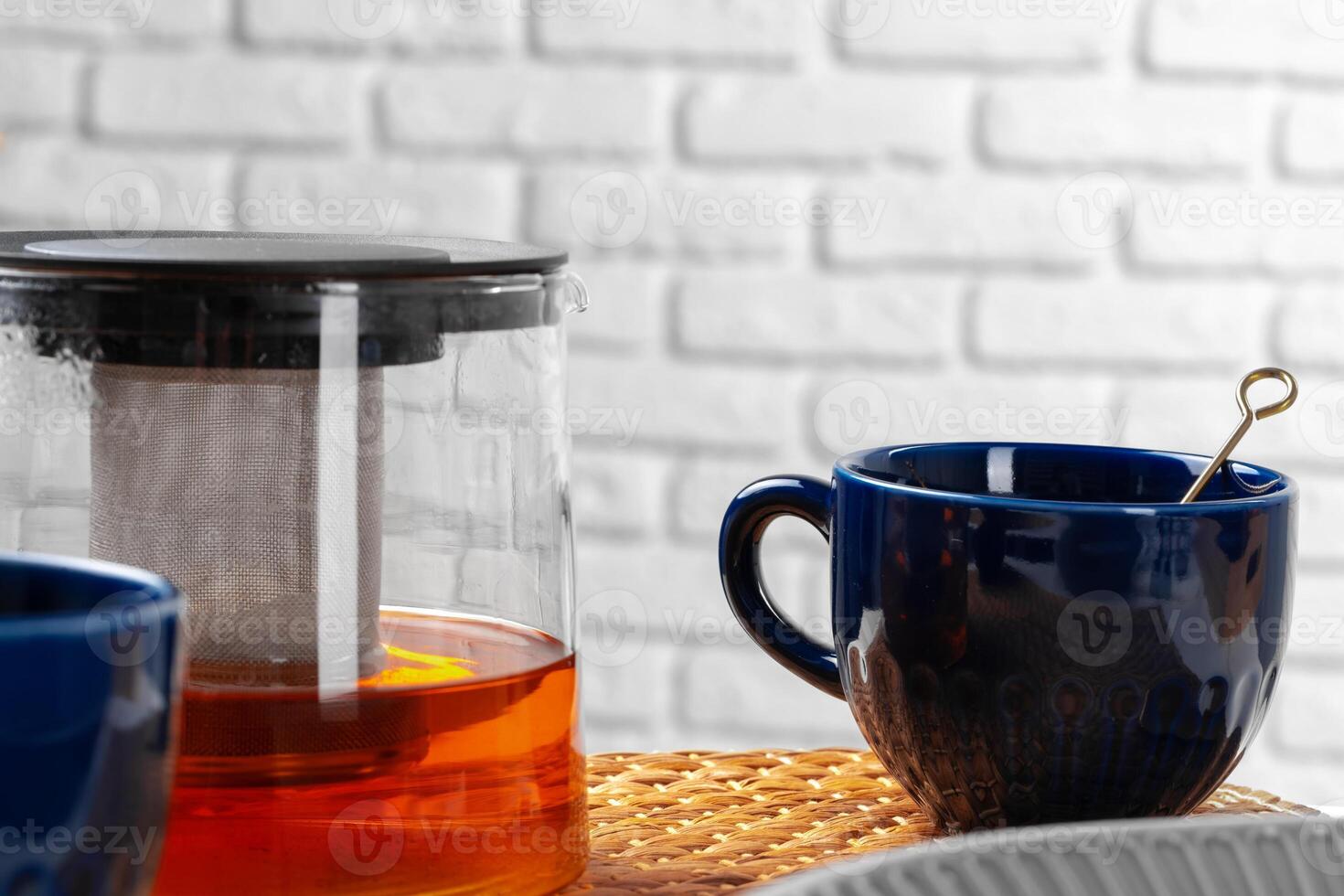Classic blue empty ceramic tea cup on kitchen table photo
