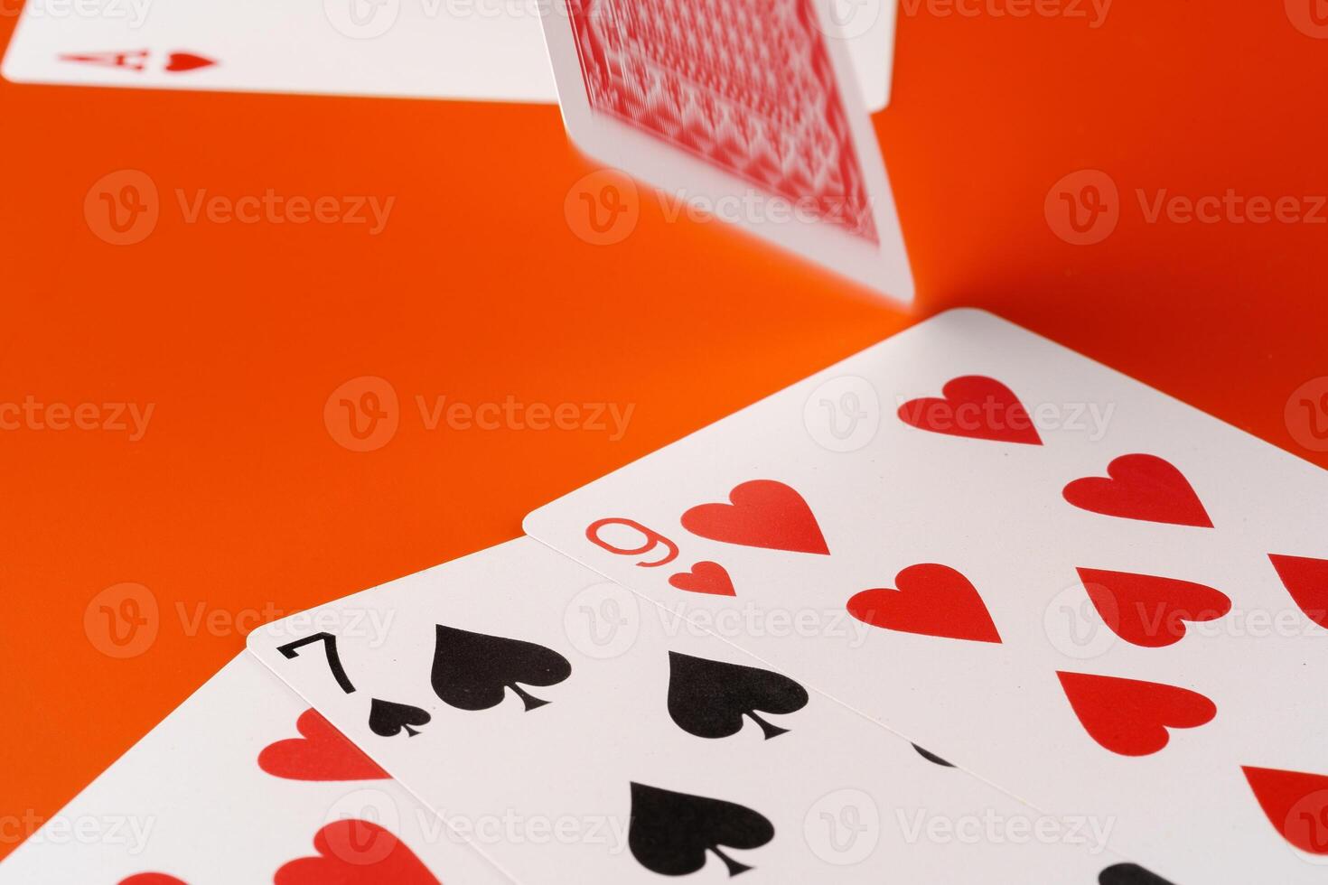Playing cards on paper background close up photo