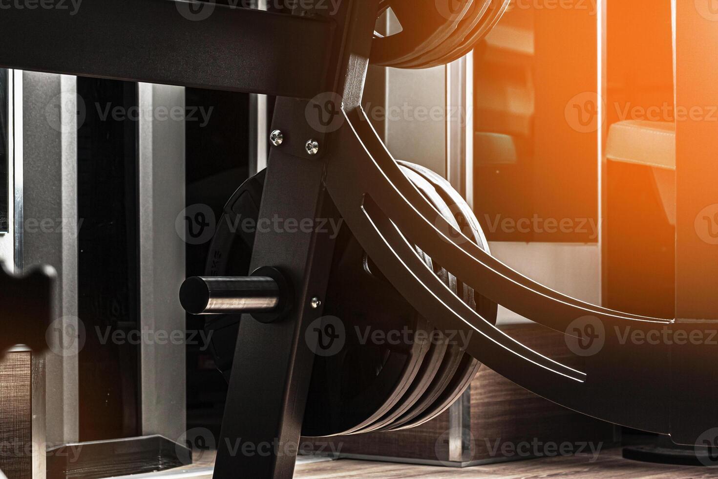 Gym weight plates on holder close up photo
