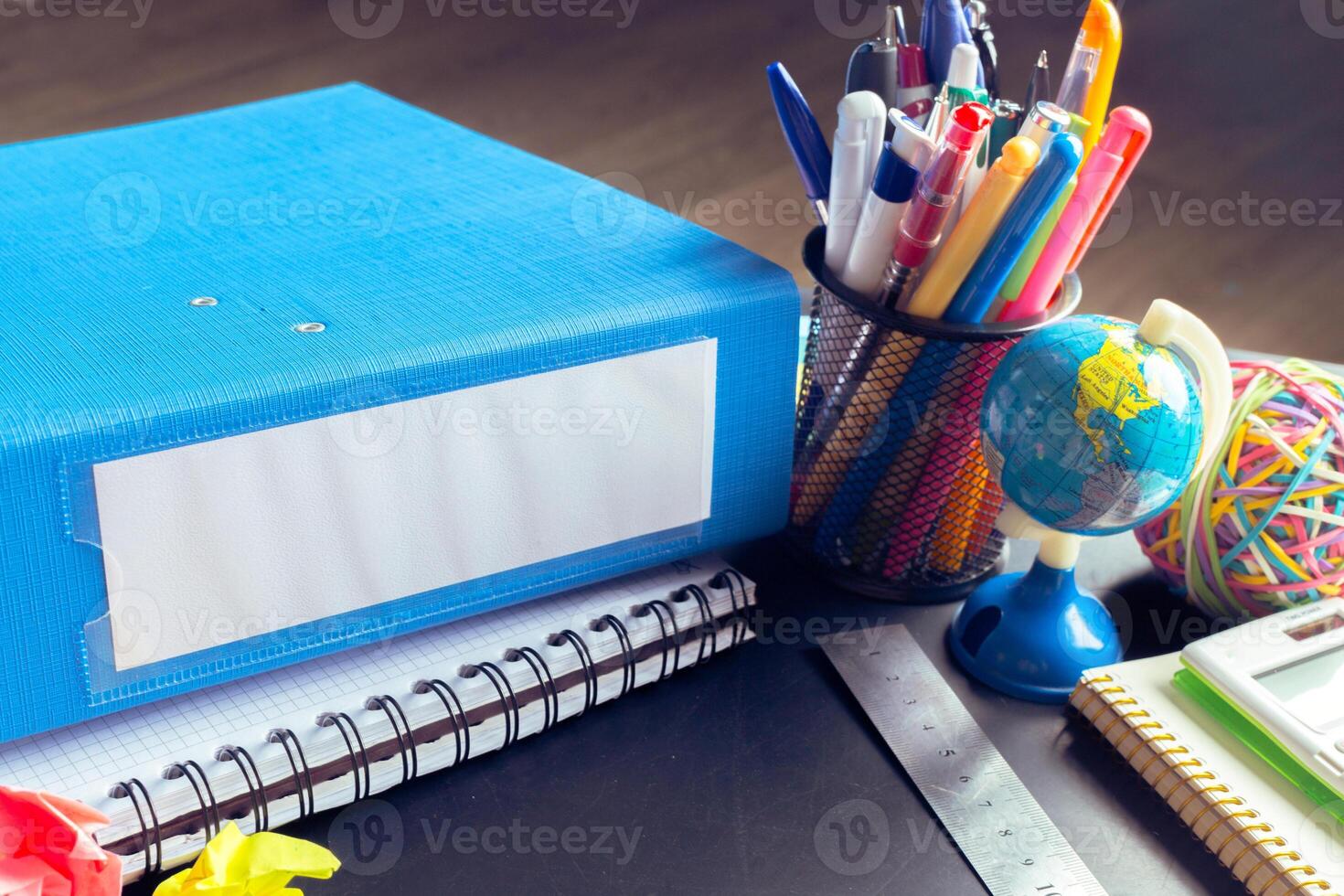 Desk of an artist with lots of stationery objects photo