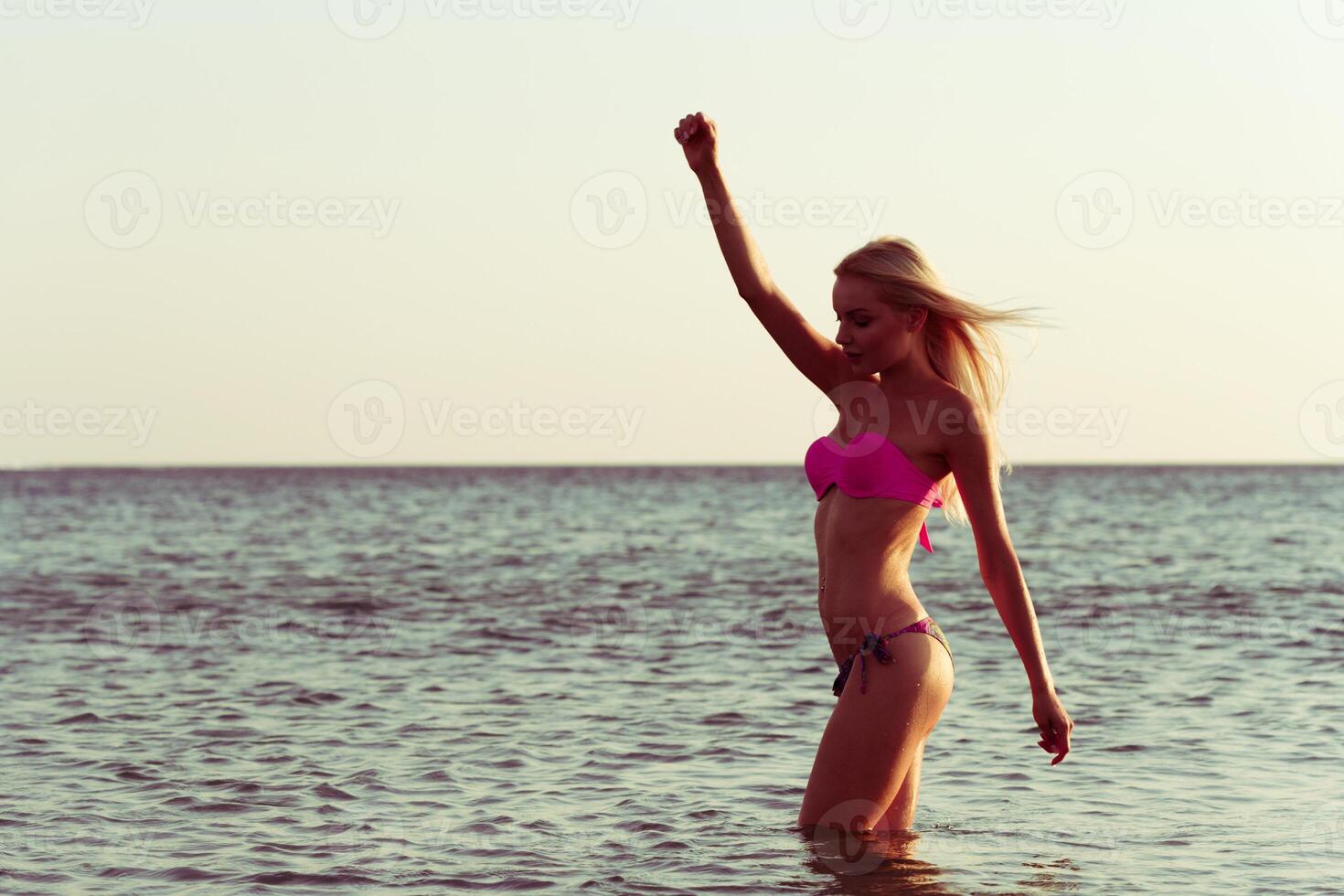 Woman in bikini on beach photo