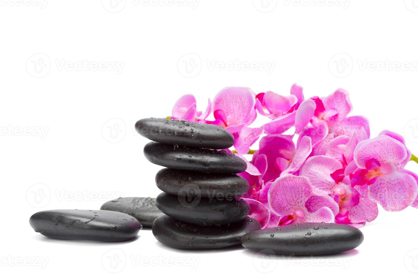 Spa stones and orchid flowers, isolated on white. photo