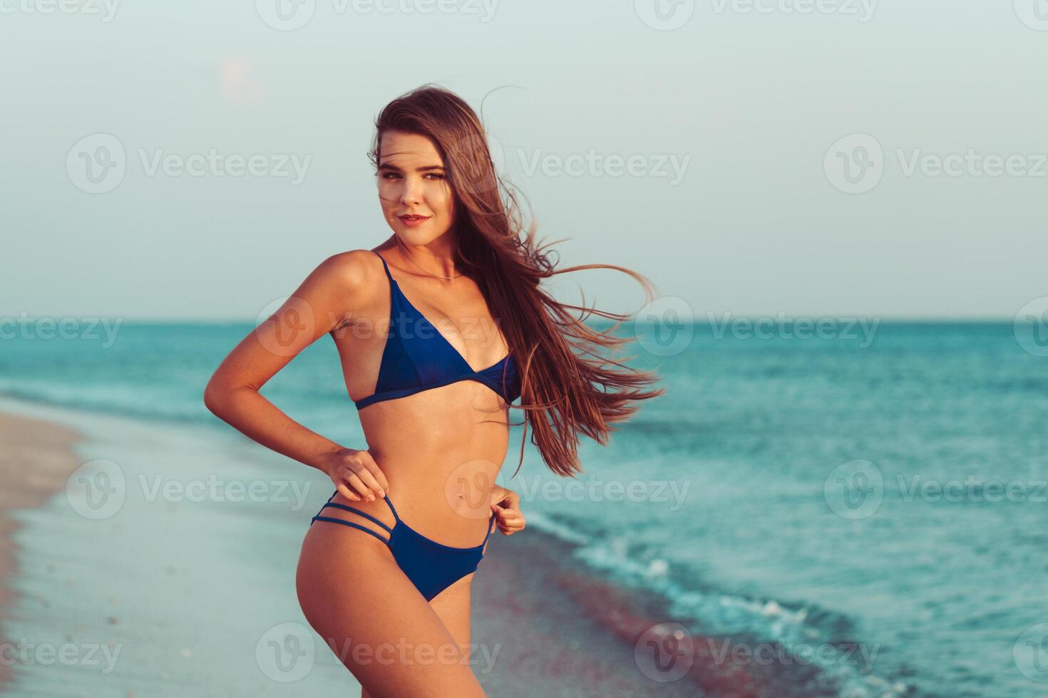 woman in bikini on beach photo