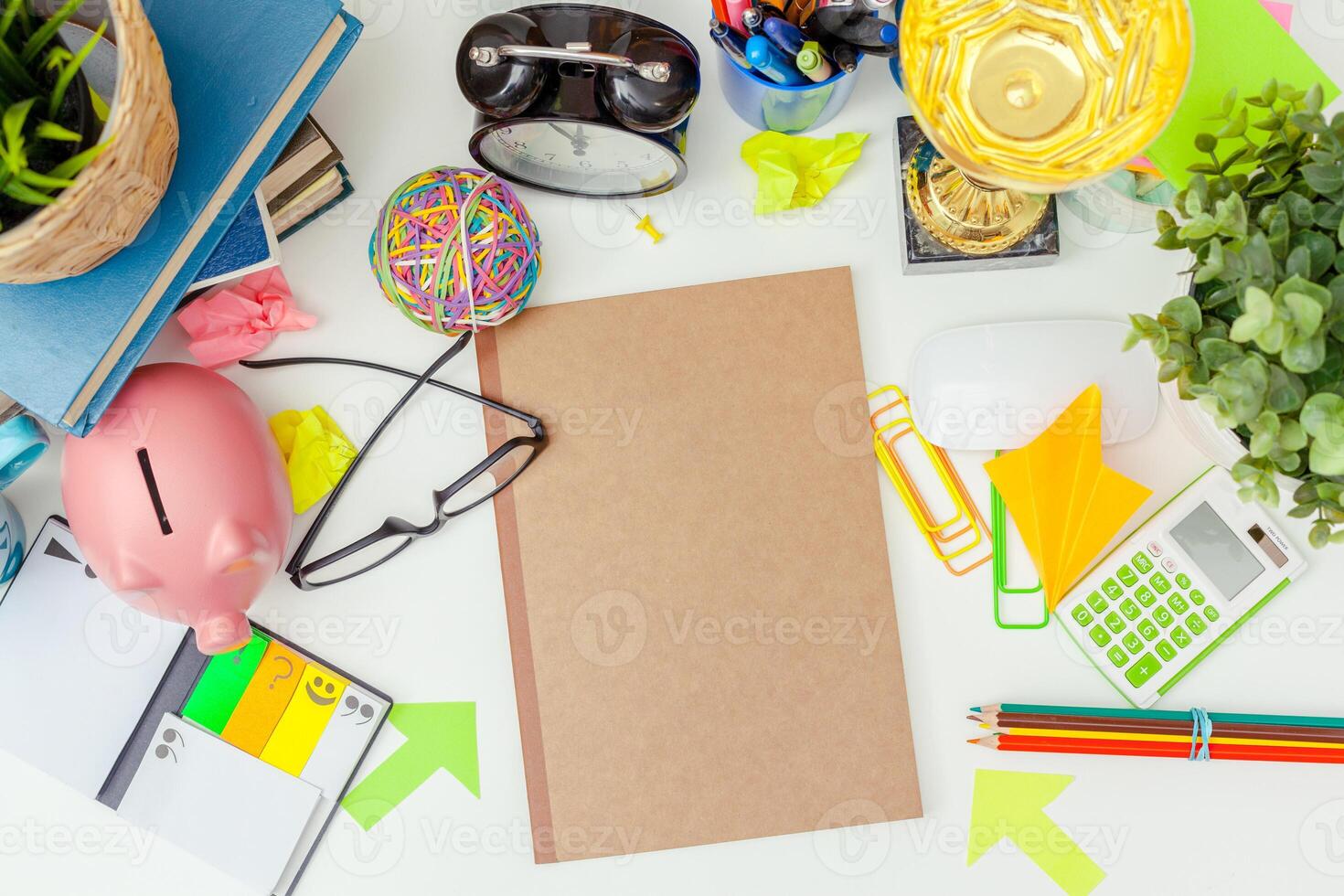 Work place of a creative person with a variety of colorful stationery objects photo