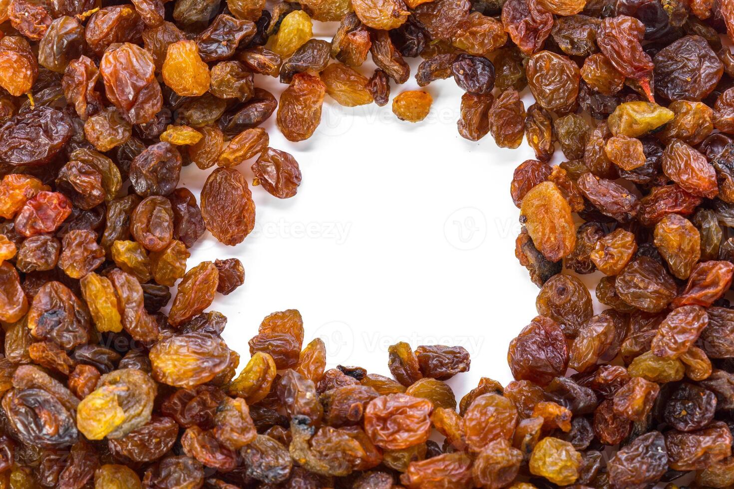 Dried raisins on a white background photo