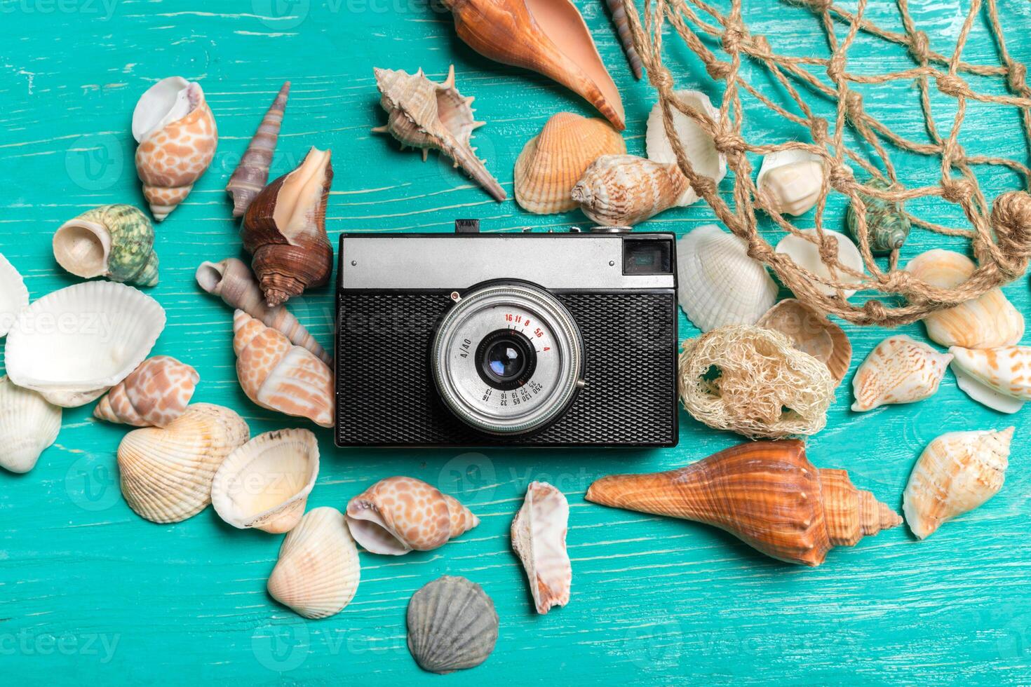 Old retro camera on wooden table background photo