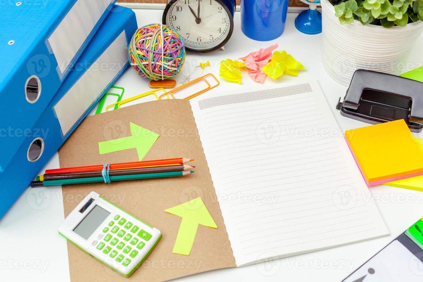 Work place of a creative person with a variety of colorful stationery objects photo