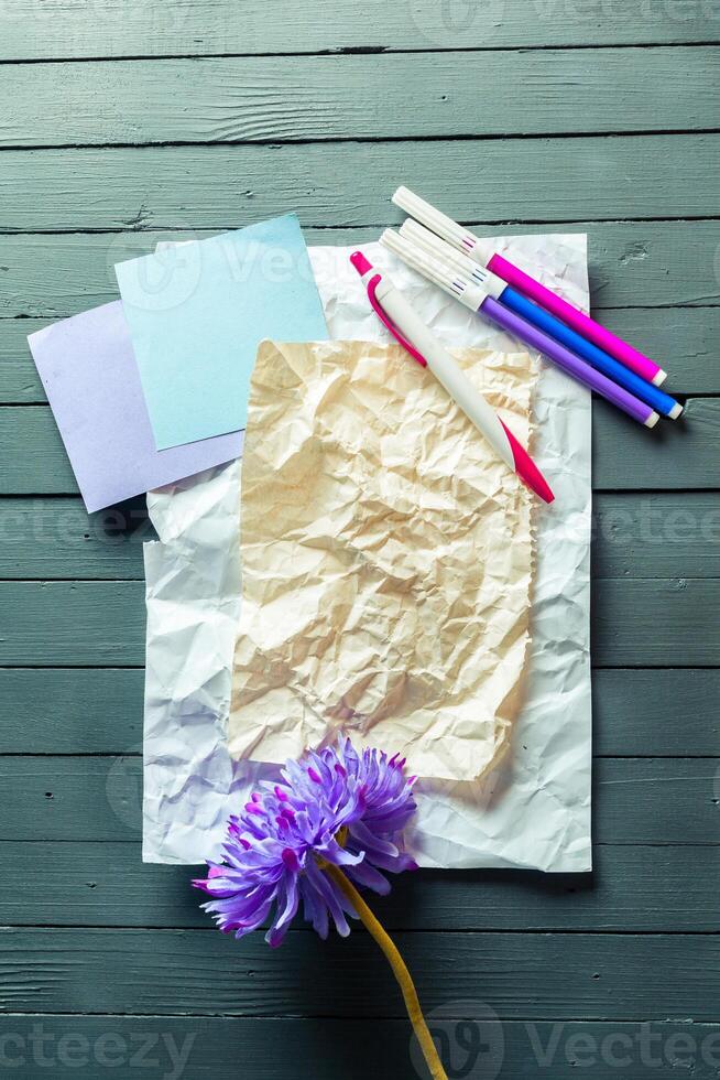 crumpled sheet of paper and pencil photo