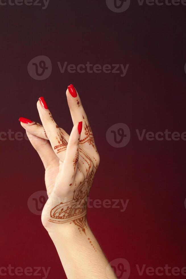 Woman Hands with mehndi photo