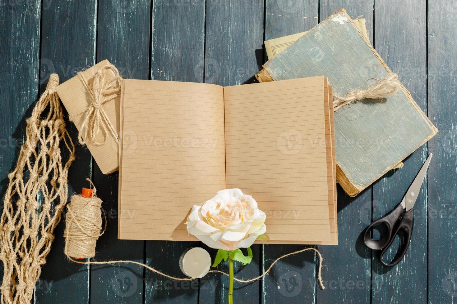 flowers with empty vintage notebook for your design photo