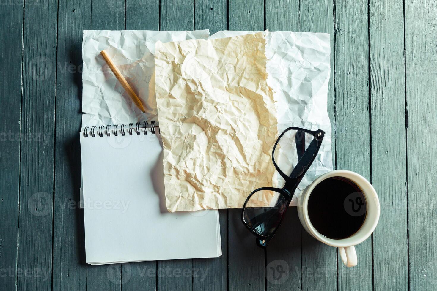crumpled sheet of paper and pencil photo