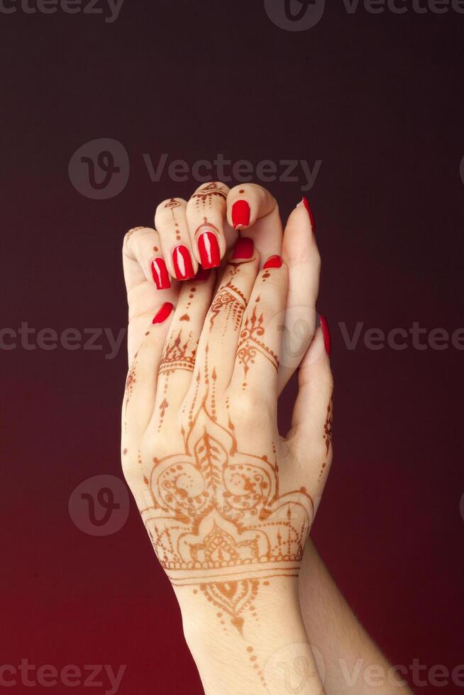 Woman Hands with mehndi photo