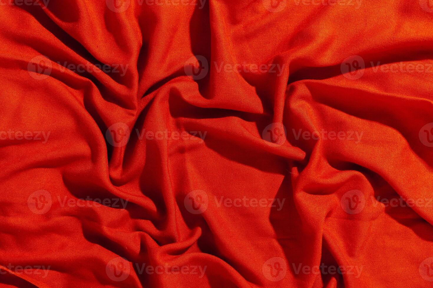 Red scarf over black wood table background photo