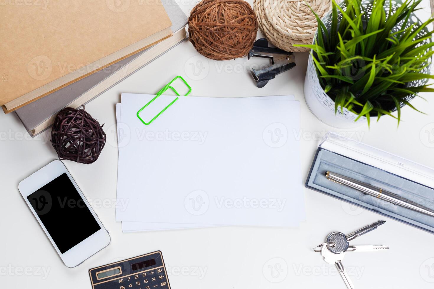 White office desk table with a lot of things on it. Top view photo