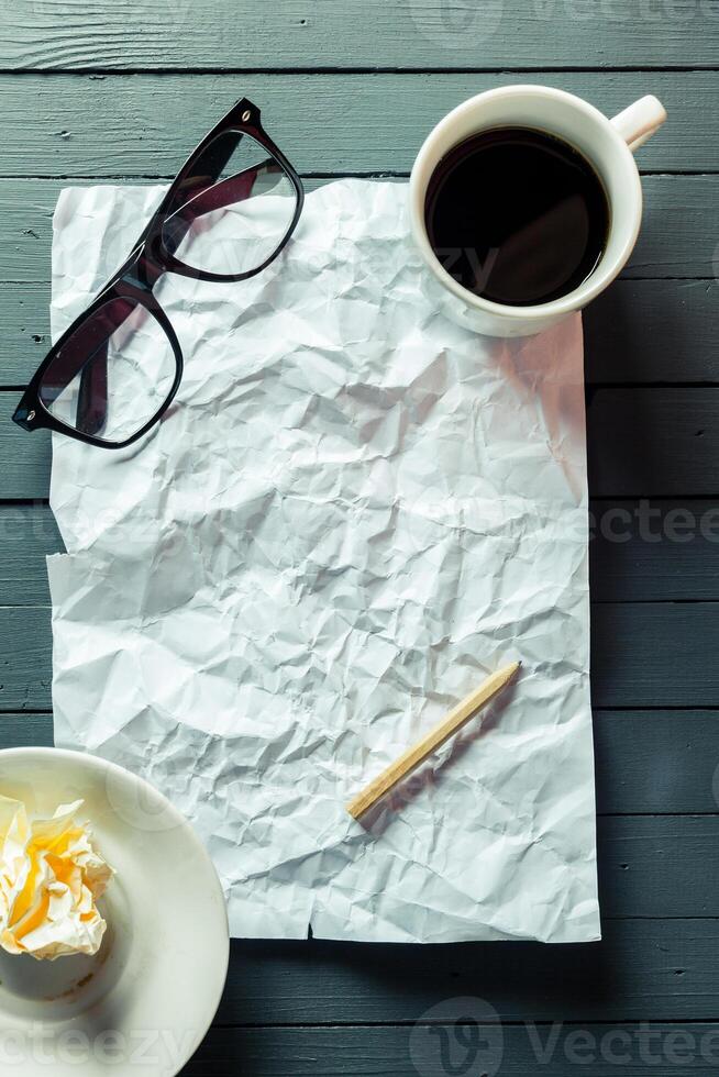 crumpled sheet of paper and pencil photo