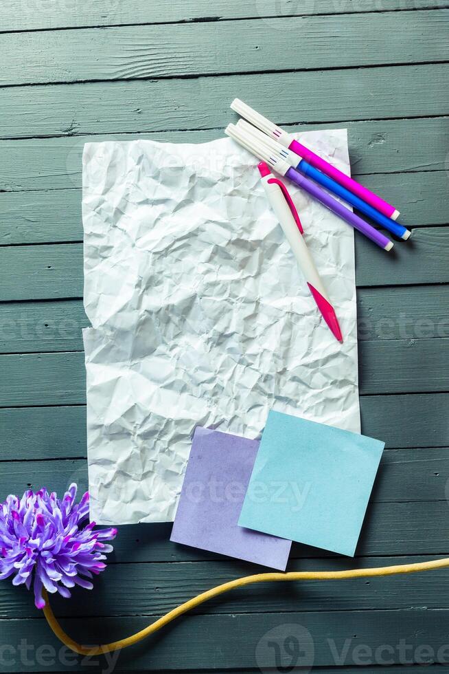 crumpled sheet of paper and pencil photo
