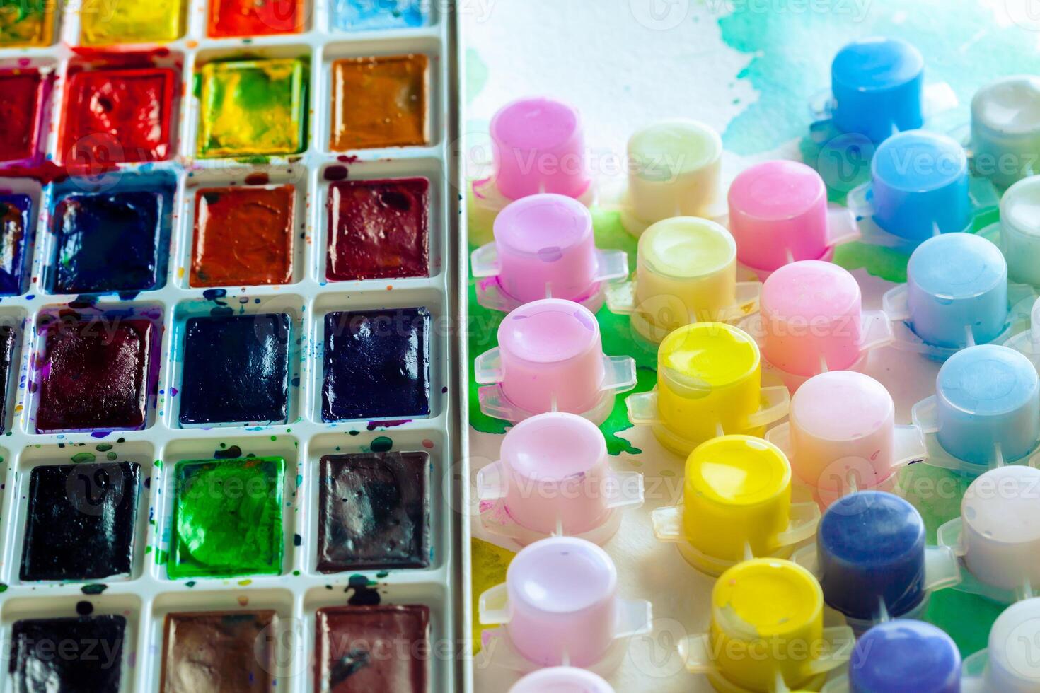 Set of watercolor paints and paintbrushes for painting photo