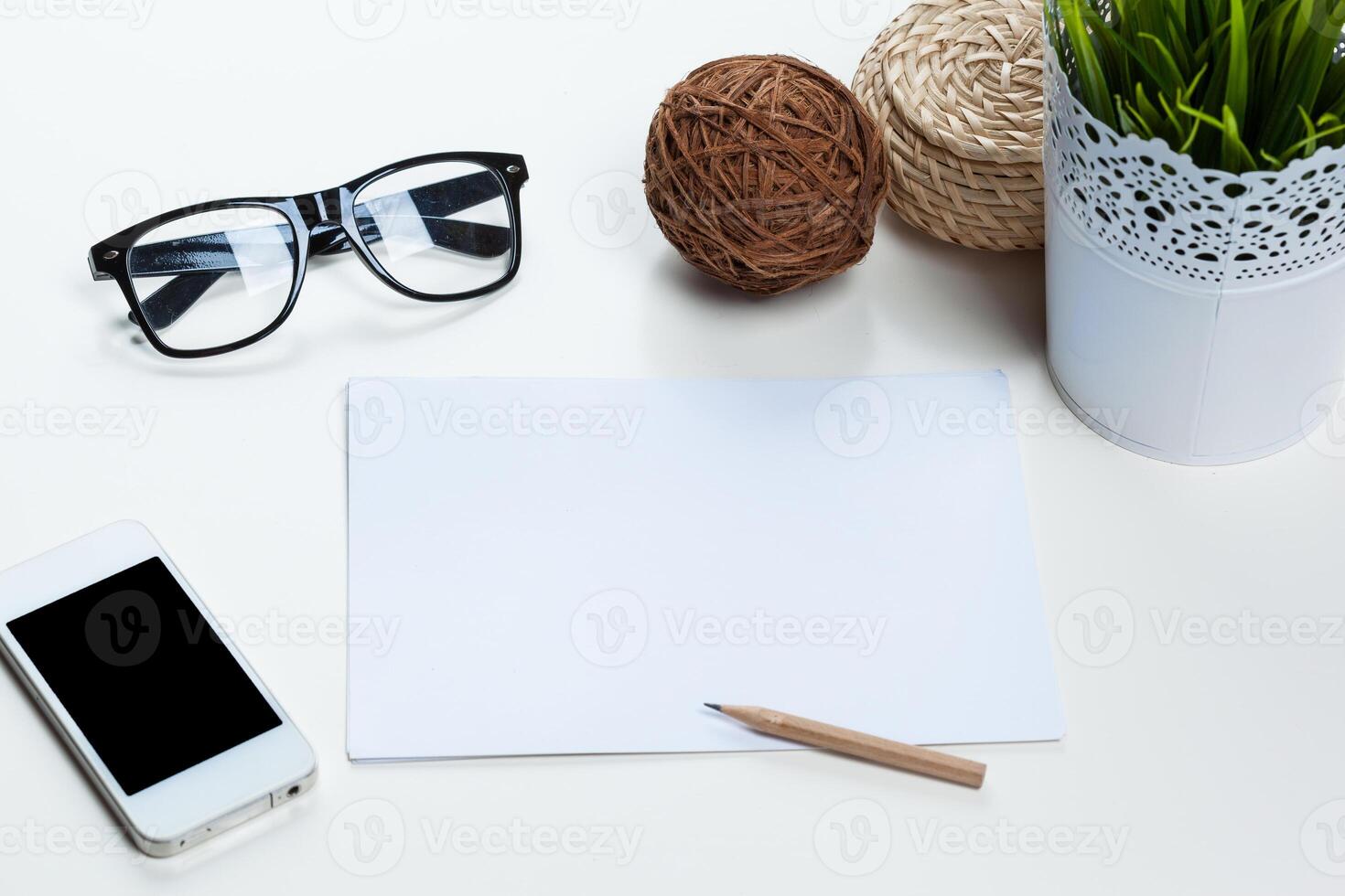 White office desk table with a lot of things on it. Top view photo