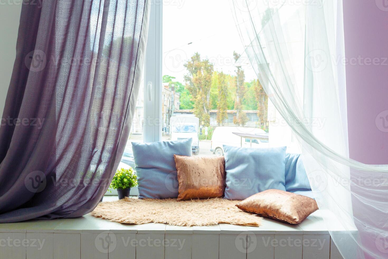 cozy window seat with cushions photo