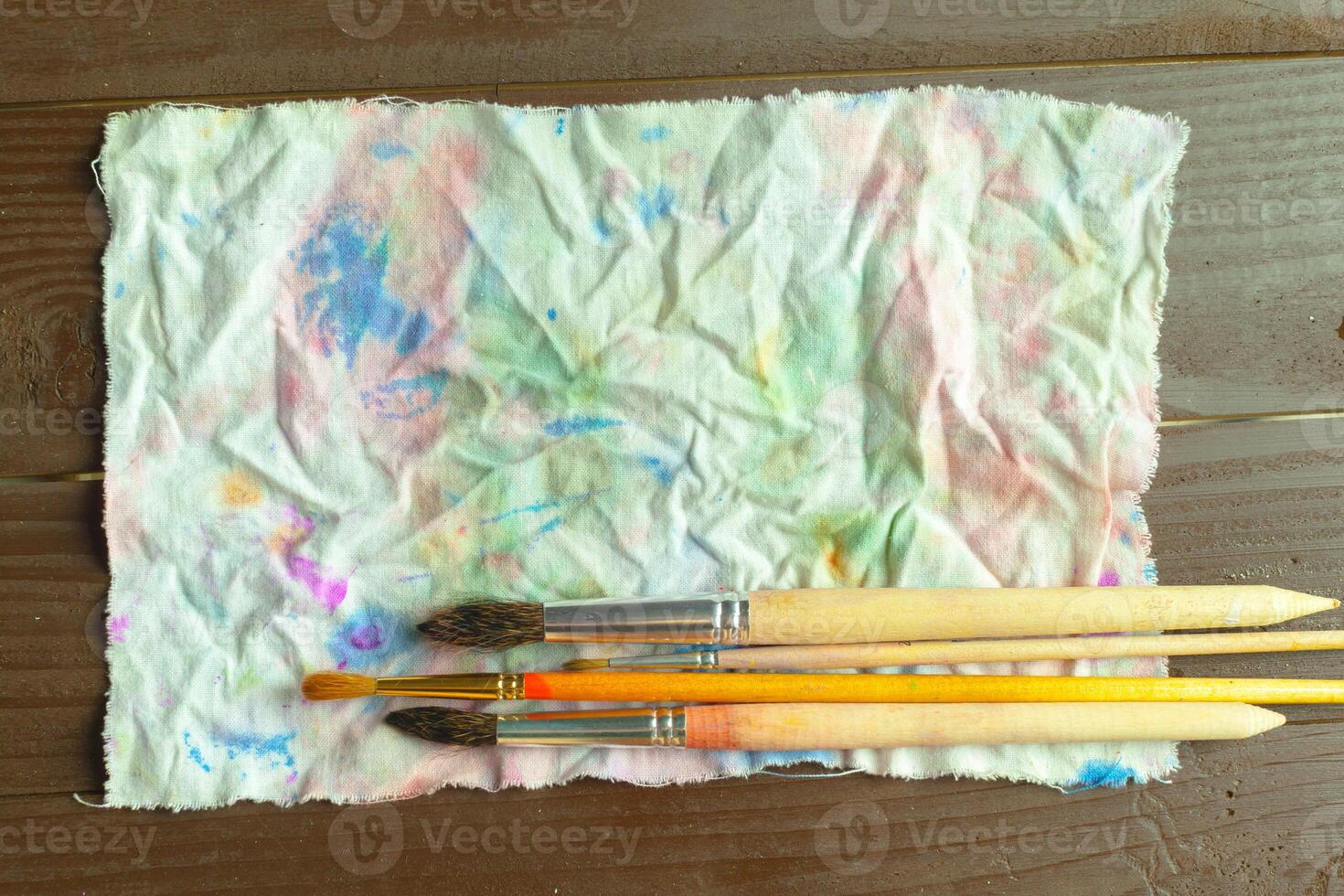 Brushes on dirty cloth photo