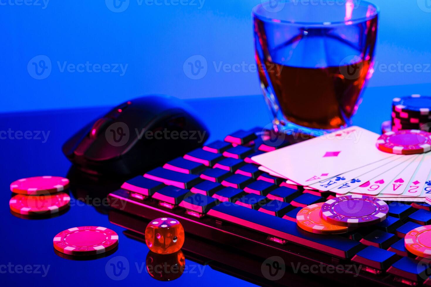 Game chips and cash on a dimly lit keyboard during an exciting gaming night at home photo
