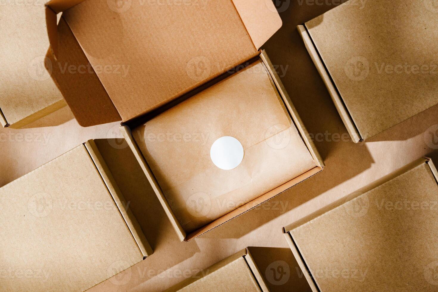 Brown cardboard boxes arranged neatly on a workspace, showcasing packaging materials for shipping and storage activities photo