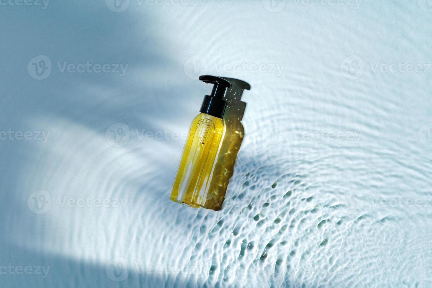 Skincare product bottle positioned against a light background with shadows photo