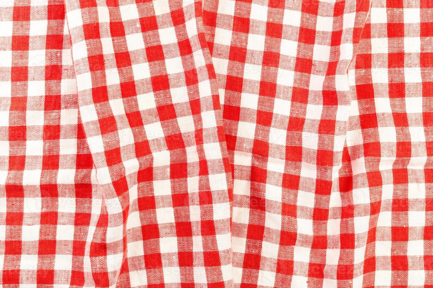 red folded tablecloth isolated on white photo