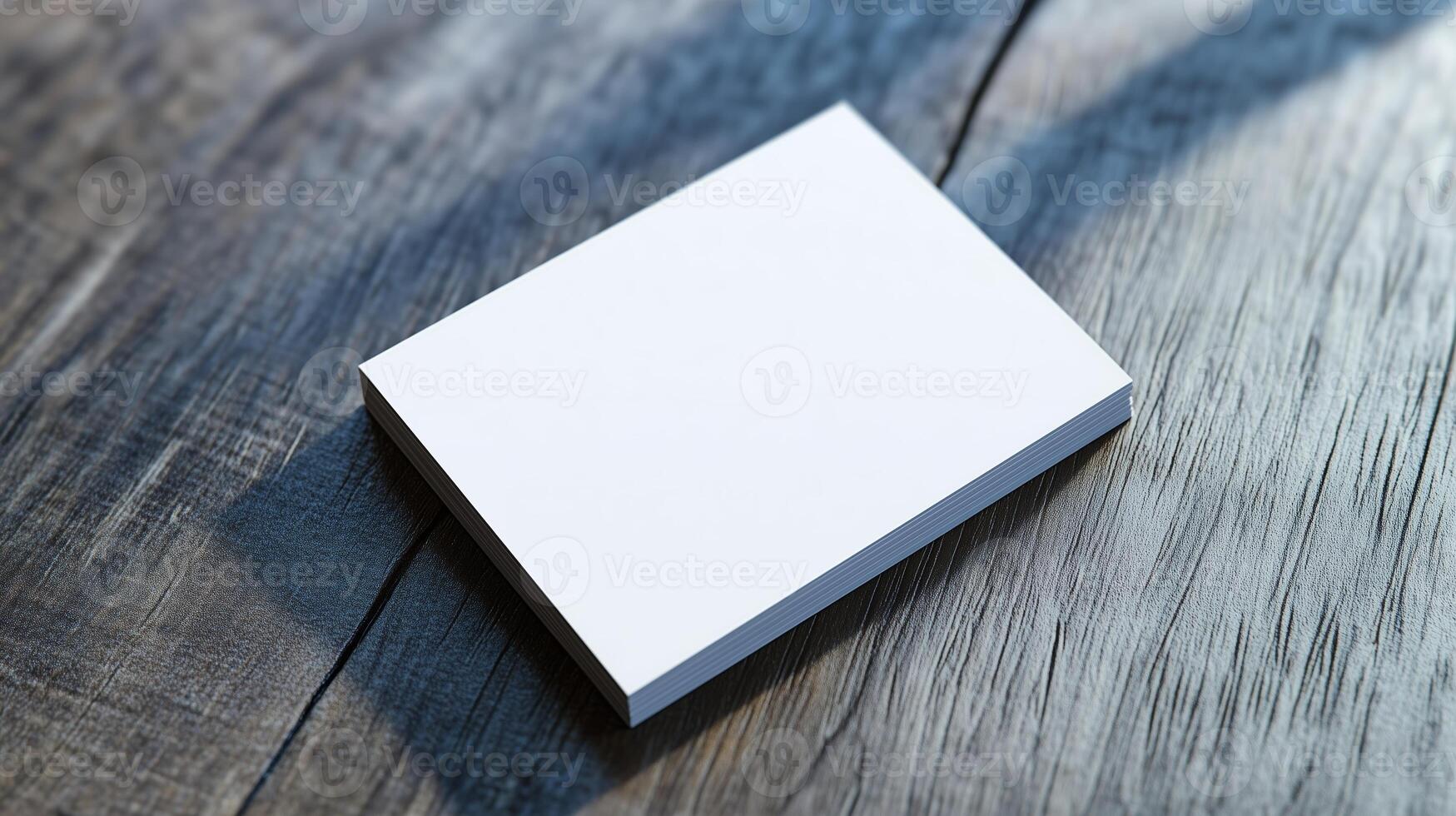 A blank notepad placed on a wooden surface, illuminated by natural light during the daytime, ready for jotting down ideas or notes photo