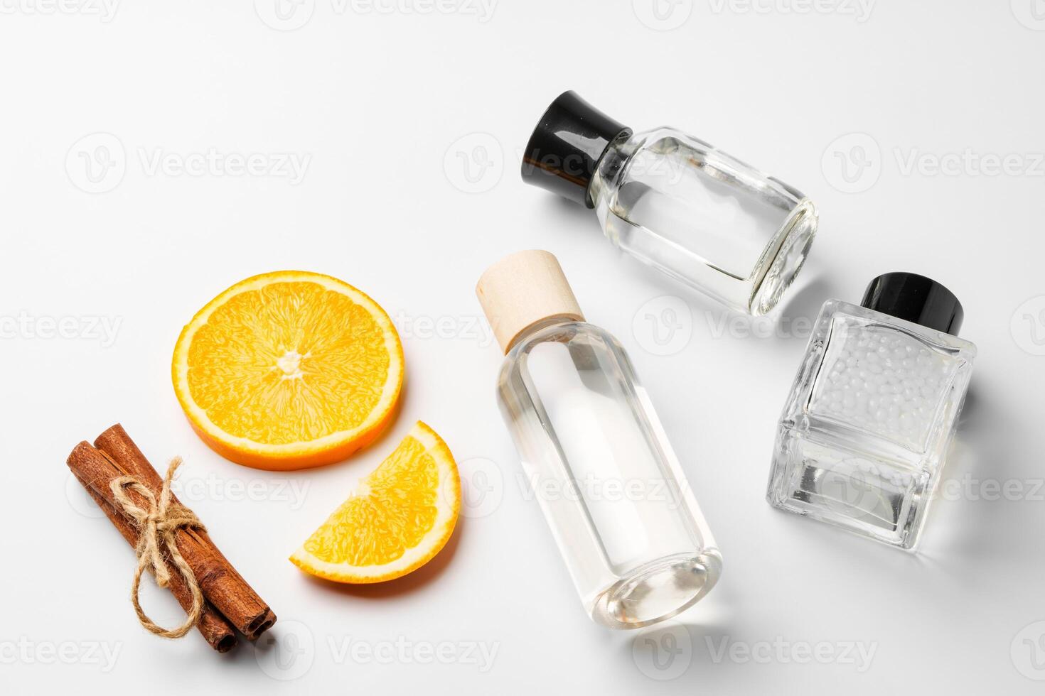 Aromatic display of essential oils with citrus fruit and chopsticks on a minimalist background photo