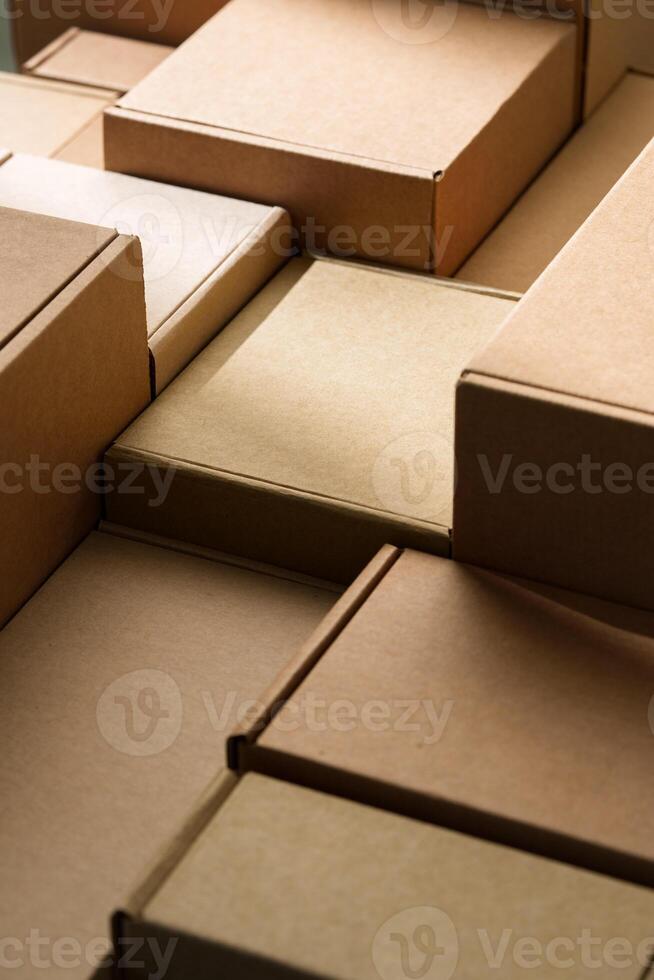 Stacked cardboard boxes arranged in a neat pattern under natural light photo