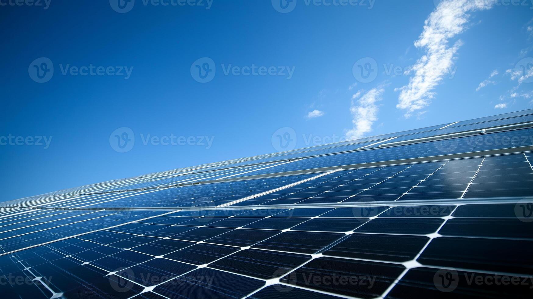 Solar panels under a clear blue sky showcasing renewable energy technology on a sunny day in a rural area photo