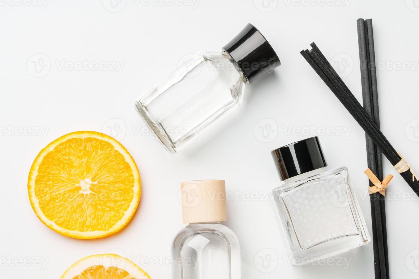 Aromatic display of essential oils with citrus fruit and chopsticks on a minimalist background photo