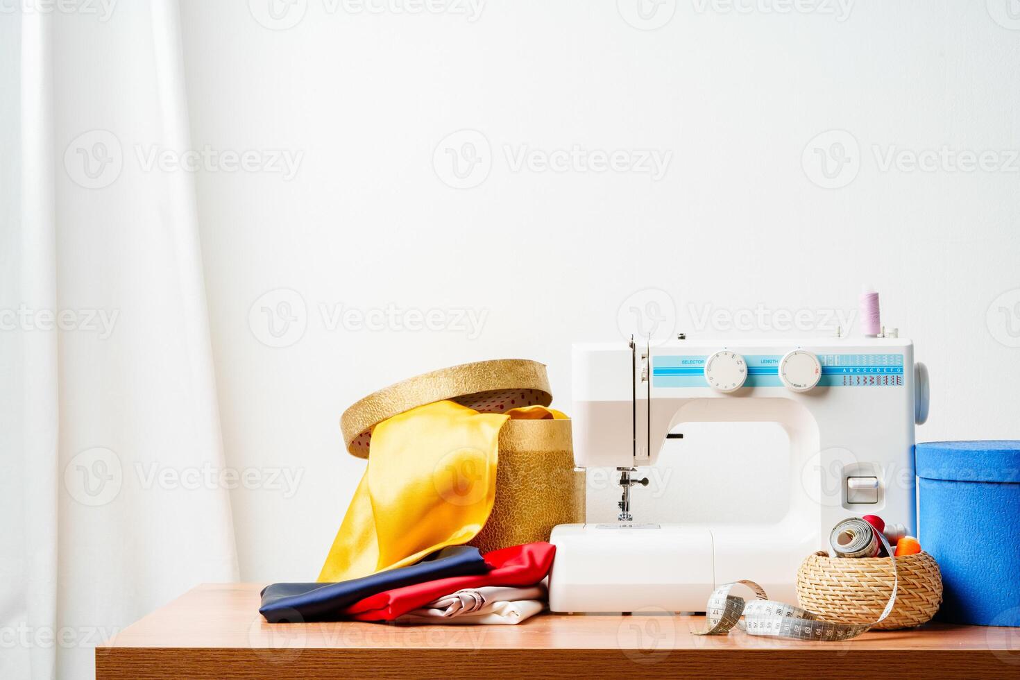 A sewing machine with colorful threads and fabric in a bright crafting space for creative projects photo