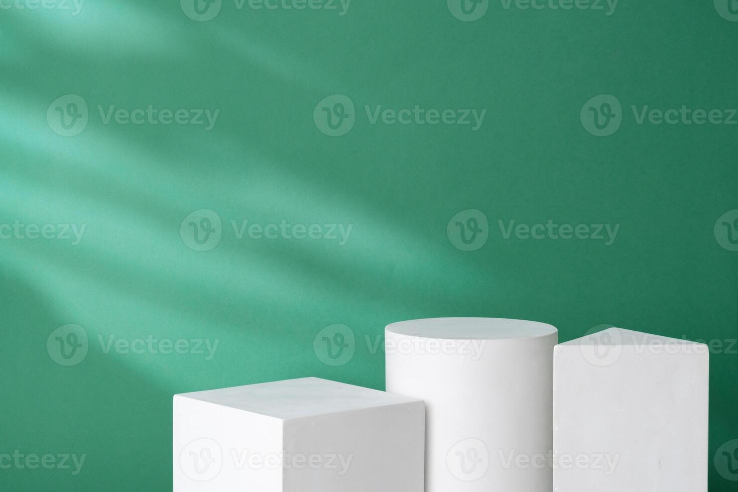 Simple geometric shapes on a green background with soft lighting photo
